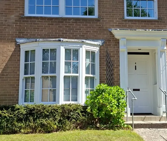 Repainted bay window and door surround on a Bransgore home